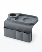Grey couch arm organizer tray with cup holder and storage pockets on white