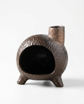 Dark ceramic chiminea ritual burner with chimney spout, studio shot on white