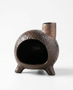 Dark ceramic chiminea ritual burner with chimney spout, studio shot on white