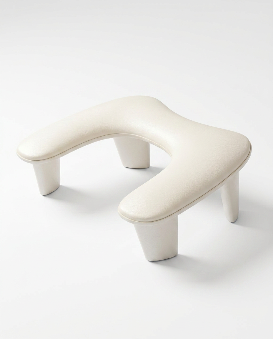 Cream U-shaped padded nail arm rest cushion on four tapered legs