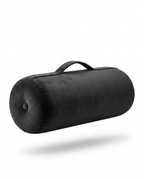 Black velvet meditation bolster with carry handle, studio packshot on white