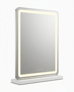 Rectangular LED vanity mirror with glowing warm-light border and touch controls, studio shot