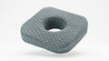 Grey honeycomb ear piercing pillow with center cavity, studio shot on white