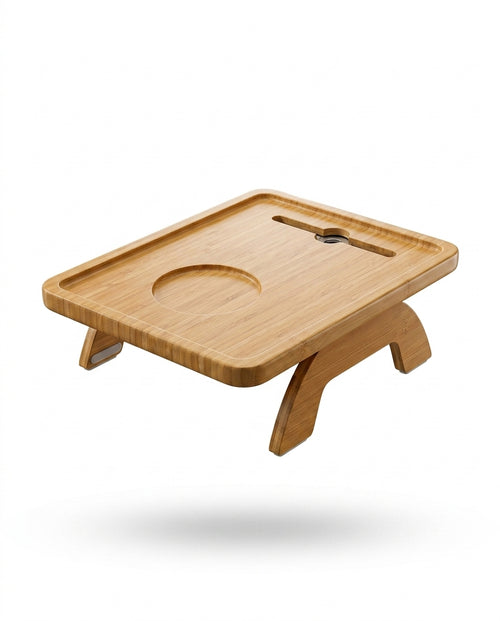 Bamboo couch arm tray table with phone slot and curved legs on white