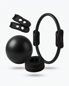 Black pilates set with fitness ring, exercise ball, resistance band and grips