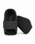 Pair of black neoprene heel cushion cups with elastic straps, on white