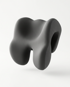 Dark gray sculpted ergonomic neck reset support cushion, studio shot on white