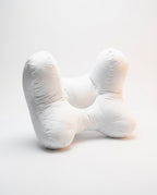 White butterfly-shaped ergonomic support pillow with central cradle, studio on white