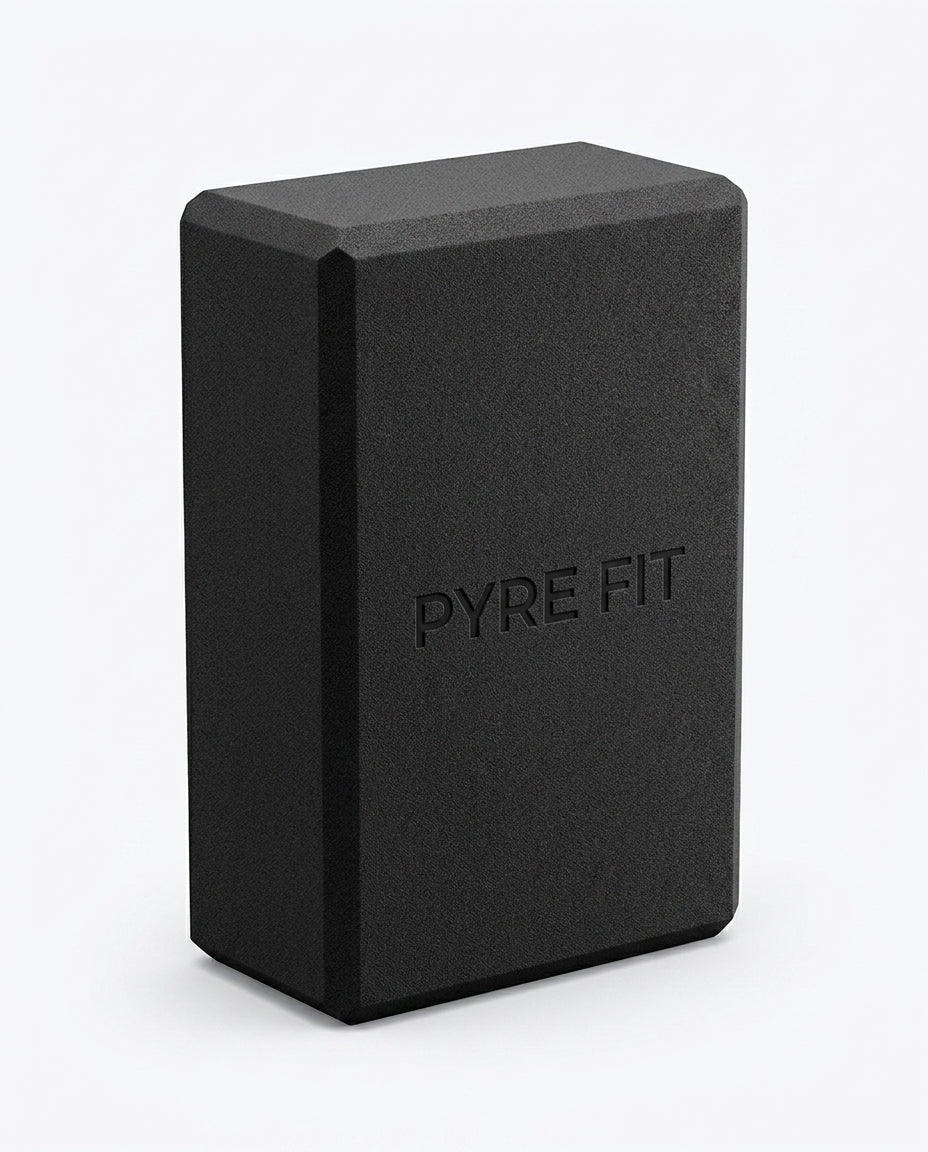 Black EVA foam yoga block with embossed Pyre Fit logo, studio shot on white