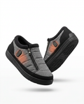 Grey rechargeable heated house slippers with side zippers, studio packshot