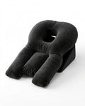 Black face-down support pillow with center face cradle and arm bolsters, studio shot