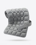 Grey quilted gel comfort pad with adjustable strap, studio shot on white