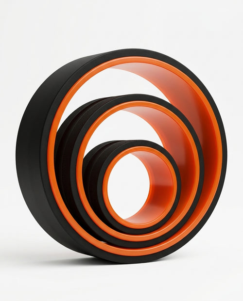 Three nested black and orange back stretching rollers in graduated sizes