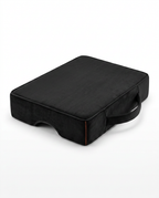 Black memory foam prayer kneeling cushion with carry handle on white