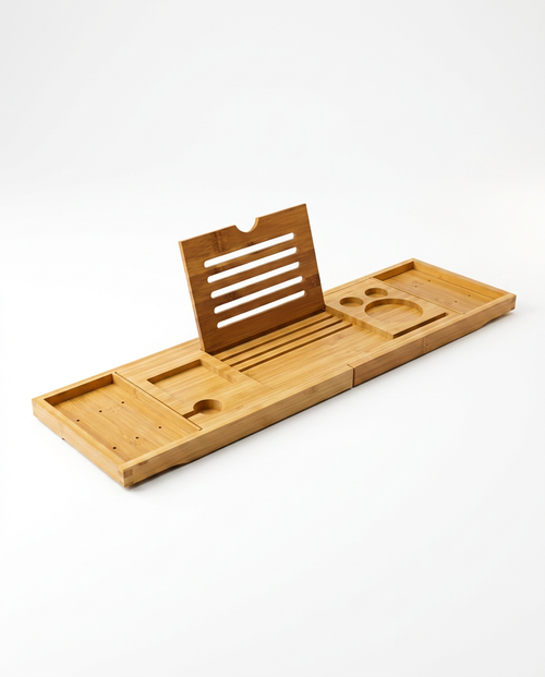 Bamboo bath caddy tray with book stand and extendable arms, studio shot