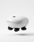 White electric scalp massager with silicone kneading claws, studio shot on white