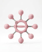 Pink 360-degree arm rotation trainer with eight weighted balls, studio shot on white