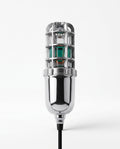 Chrome electric shoe dryer with caged UV head and green glow, on white