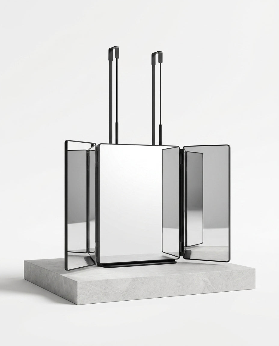 Trifold 360-degree grooming mirror with black frames and straps on stone plinth