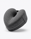 Grey memory foam leg pillow with contoured channel and strap, studio shot