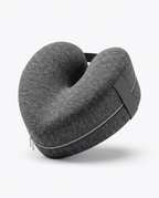 Grey memory foam leg pillow with contoured channel and strap, studio shot