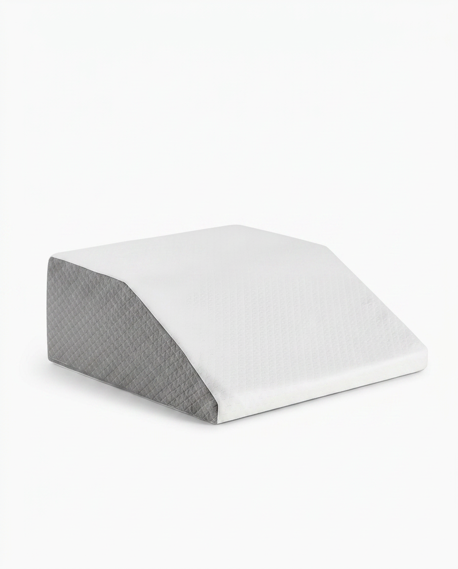 White and grey memory foam leg elevation wedge pillow on a white background