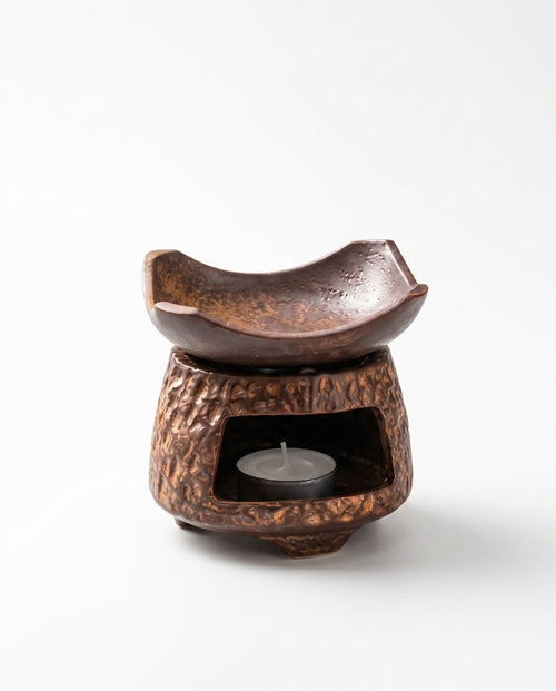 Brown textured ceramic relaxation oil burner with tealight, studio packshot