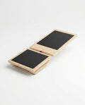 Wooden ankle balance board with two pivoting non-slip platforms on white