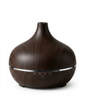 Dark wood-grain essential oil aromatherapy diffuser with timer buttons, studio shot