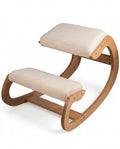 Bentwood ergonomic kneeling chair with cream padded cushions, studio shot