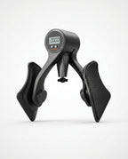 Black digital hip trainer with LCD counter and ergonomic thigh pads, studio shot