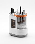 White automatic makeup brush cleaner machine with touch display and brushes, studio shot