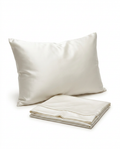 Ivory mulberry silk pillowcase on a pillow with a folded spare, studio shot