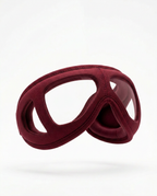 Burgundy heated eye relaxation massager mask, studio shot on white