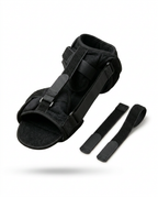 Black night foot support brace with adjustable straps on white