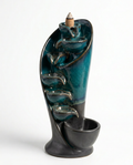 Teal crackle-glaze ceramic waterfall incense burner, studio packshot on white