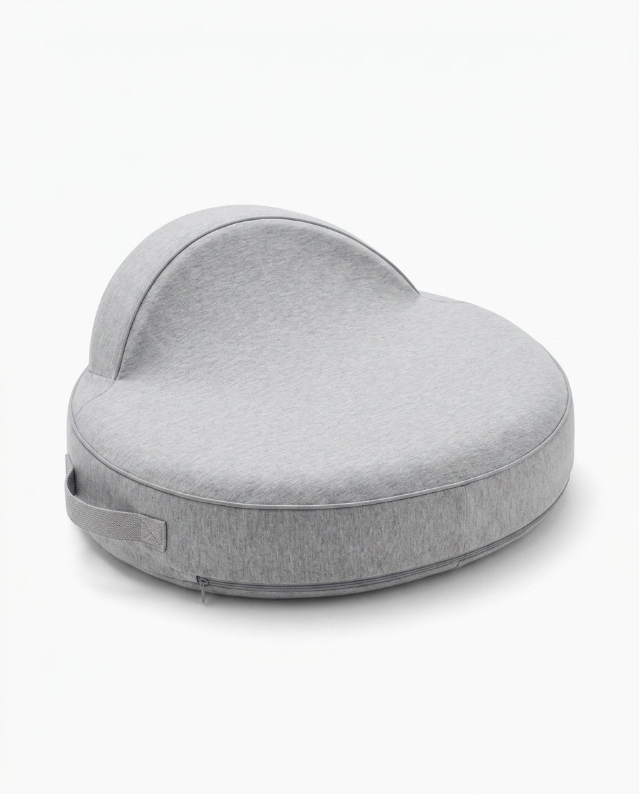 Grey curved feeding support pillow with side handle, studio packshot