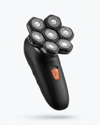 Three-quarter view of the 7D shaver showing the orange power button on the handle