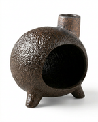 Three-quarter angle of the textured bronze ceramic ritual burner on white