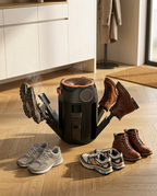 Shoe dryer drying boots and sneakers on a wood entryway floor