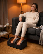 Woman relaxing on a couch with feet in the foot massager in a living room