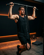 Man doing assisted pull-ups with a resistance band looped over a bar