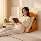Woman reading in bed propped against yellow ergonomic wedge back support pillow