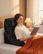 Woman reading a tablet in bed propped up on the black adjustable bed wedge system