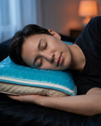 Man asleep on his side resting his cheek on the blue cooling gel pillow