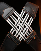 Close-up of the woven black and white crossover straps on the brace