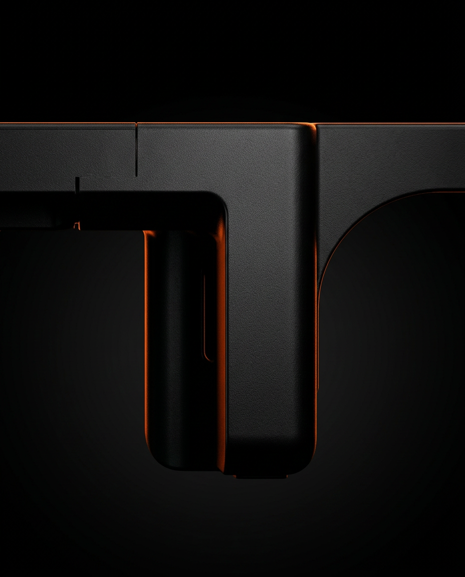 Macro of the monitor riser's arched leg with orange edge lighting