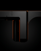 Macro of the monitor riser's arched leg with orange edge lighting