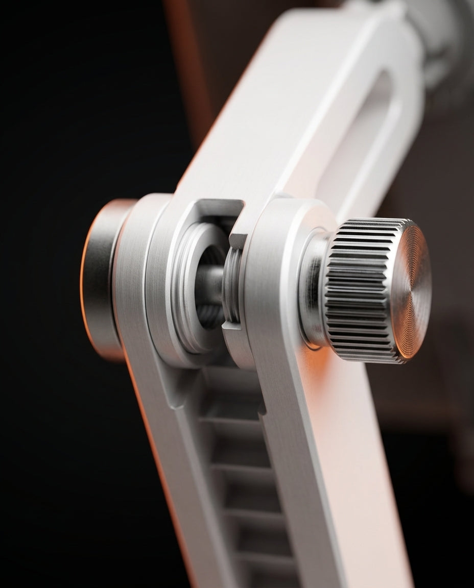 Macro of the tablet stand's articulated arm joint and knurled aluminum tension knob