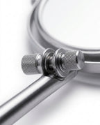 Macro of the knurled chrome swivel joints connecting the mirror to its arm
